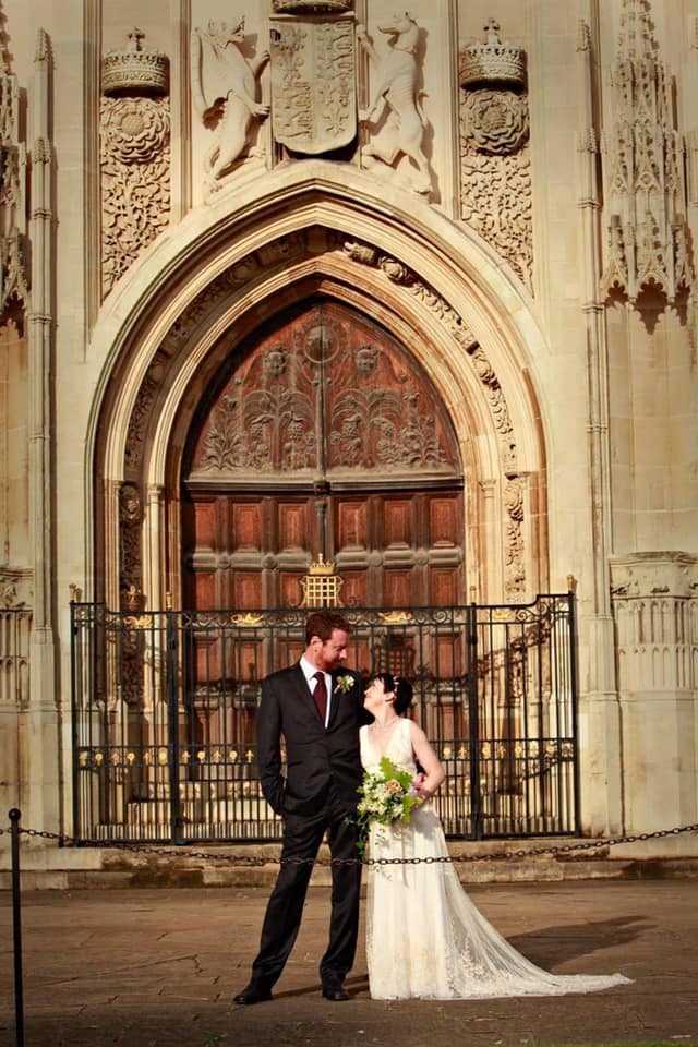 married couple in a front of a church